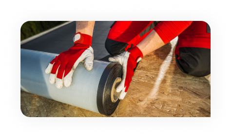 Worker drawing on plans