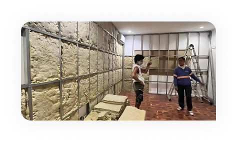 Worker drawing on plans