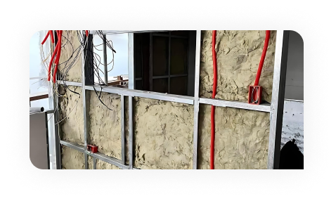 Worker drawing on plans