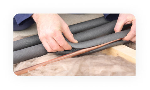 Worker drawing on plans