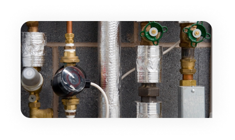 Worker drawing on plans