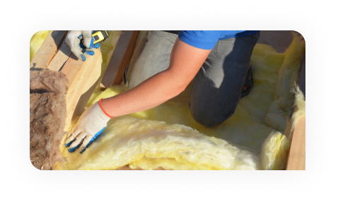 Worker drawing on plans