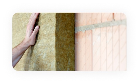 Worker drawing on plans