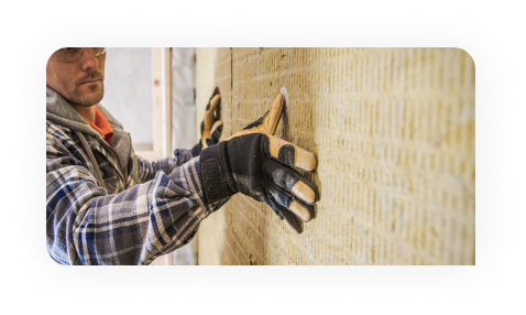 Worker drawing on plans